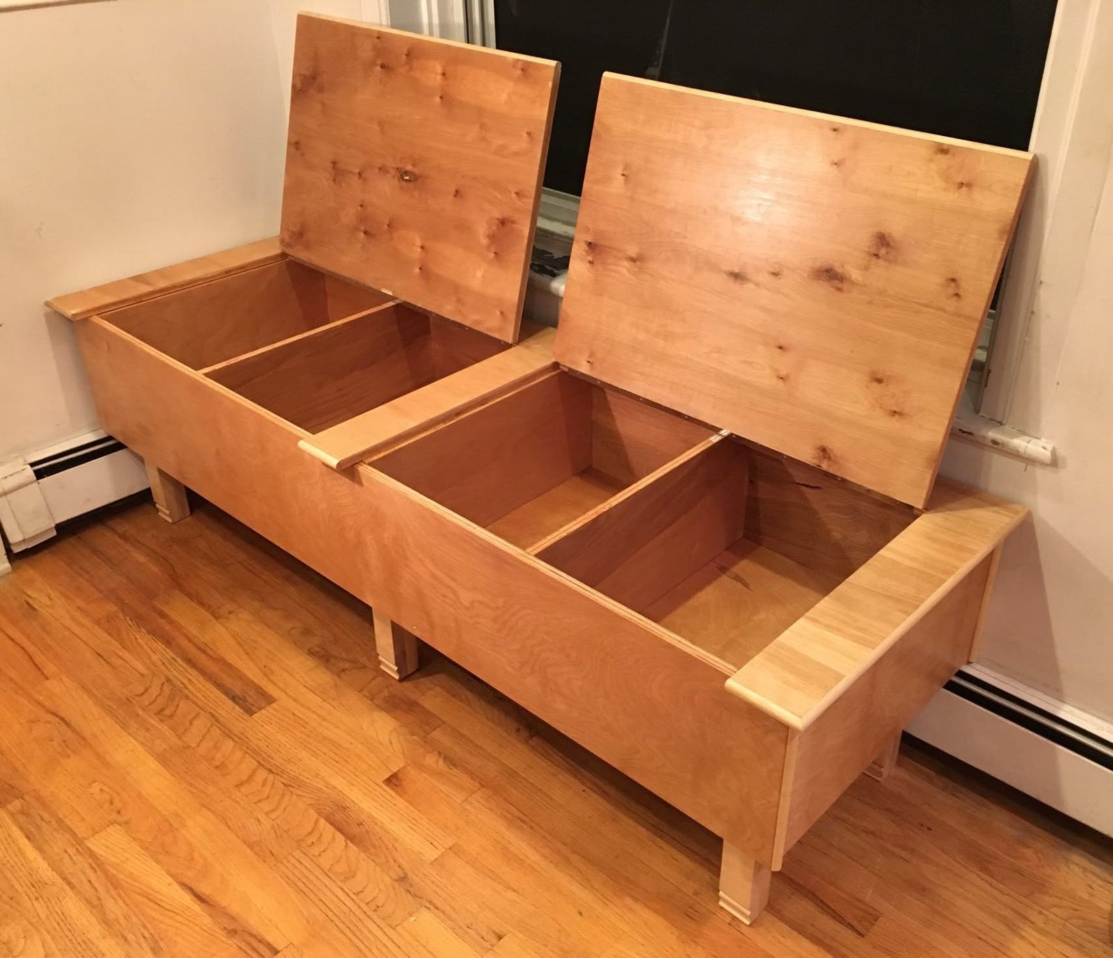 Wood storage bench with two lift-top lids open